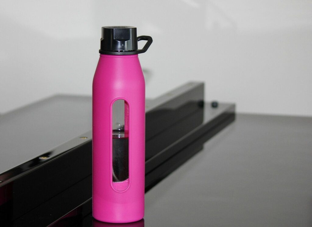water bottle, hot pink bottle, water, bottle, piano, drink, pink, nature, liquid, gray water, gray bottle, gray piano